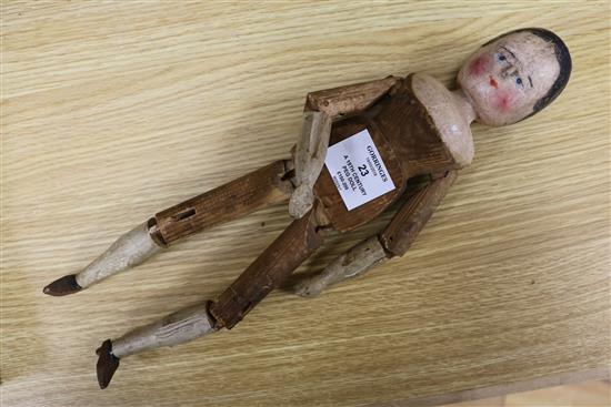 A 19th century folk art peg doll 36cm.